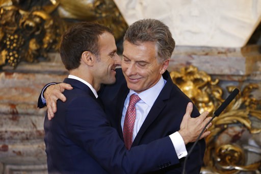 (AP Photo/Natacha Pisarenko). France's President Emmanuel Macron, left, and Argentina's President Mauricio Macri embrace after a joint press conference at the presidential palace in Buenos Aires, Argentina, Thursday, Nov. 29, 2018. Macron will attend t... (AP Photo/Natacha Pisarenko). France's President Emmanuel Macron, left, and Argentina's President Mauricio Macri embrace after a joint press conference at the presidential palace in Buenos Aires, Argentina, Thursday, Nov. 29, 2018. Macron will attend t...
