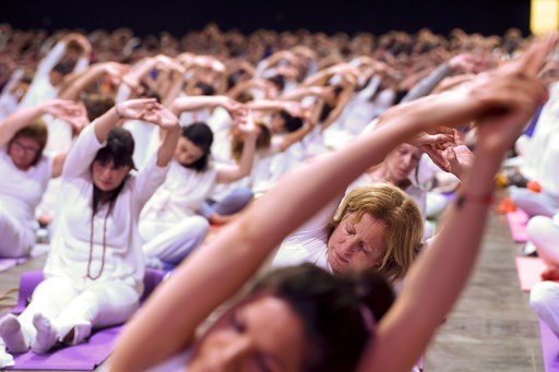 (AP Photo/Gustavo Garello). Attendants stretch during a Yoga for Peace event led by India's Prime Minister Narendra Modi at La Rural Convention Center in Buenos Aires, Argentina, Thursday, Nov. 29, 2018. Modi and other leaders from the Group of 20 indu... (AP Photo/Gustavo Garello). Attendants stretch during a Yoga for Peace event led by India's Prime Minister Narendra Modi at La Rural Convention Center in Buenos Aires, Argentina, Thursday, Nov. 29, 2018. Modi and other leaders from the Group of 20 indu...