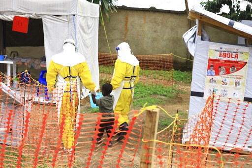 (AP Photo/Al-hadji Kudra Maliro, FILE). FILE - In this file photo dated Sunday, Sept. 9, 2018, health workers walk with a boy suspected as having the Ebola virus at an Ebola treatment centre in Beni, Eastern Congo. According to a WHO announcement Thur... (AP Photo/Al-hadji Kudra Maliro, FILE). FILE - In this file photo dated Sunday, Sept. 9, 2018, health workers walk with a boy suspected as having the Ebola virus at an Ebola treatment centre in Beni, Eastern Congo. According to a WHO announcement Thur...