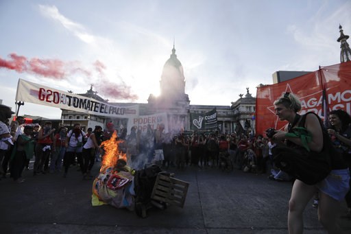 (AP Photo/Natacha Pisarenko). Protesters burn an effigy of President Donald Trump during a march against the G20 summit being held in Buenos Aires, Argentina, Friday, Nov. 30, 2018. Leaders from the Group of 20 industrialized nations are meeting in Bue... (AP Photo/Natacha Pisarenko). Protesters burn an effigy of President Donald Trump during a march against the G20 summit being held in Buenos Aires, Argentina, Friday, Nov. 30, 2018. Leaders from the Group of 20 industrialized nations are meeting in Bue...
