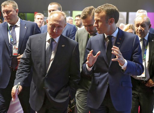 (Mikhail Klimentyev, Sputnik, Kremlin Pool Photo via AP). Russian President Vladimir Putin, left, listens as France's President Emmanuel Macron speaks to him at the G20 summit in Buenos Aires, Argentina, Friday, Nov. 30, 2018. Leaders from the Group of... (Mikhail Klimentyev, Sputnik, Kremlin Pool Photo via AP). Russian President Vladimir Putin, left, listens as France's President Emmanuel Macron speaks to him at the G20 summit in Buenos Aires, Argentina, Friday, Nov. 30, 2018. Leaders from the Group of...