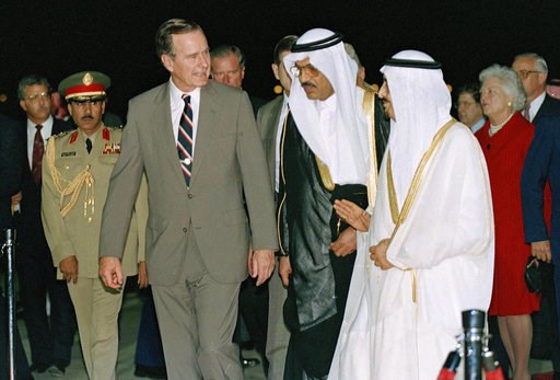 (AP Photo/J. Scott Applewhite, File). FILE - In this Nov. 21, 1990 file photo, President George H.W. Bush is greeted by King Fahd as he arrives in Saudi Arabia. At right is first lady Barbara Bush. At center is an interpreter. Bush died at the age of 9... (AP Photo/J. Scott Applewhite, File). FILE - In this Nov. 21, 1990 file photo, President George H.W. Bush is greeted by King Fahd as he arrives in Saudi Arabia. At right is first lady Barbara Bush. At center is an interpreter. Bush died at the age of 9...