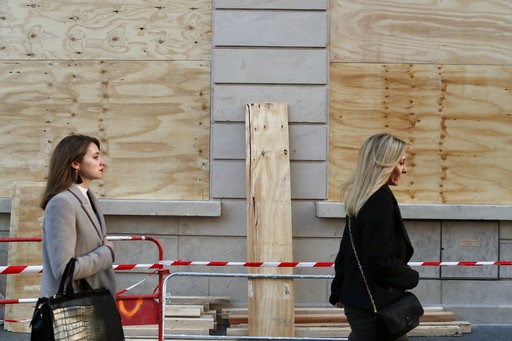 (AP Photo/Thibault Camus). Women walk past barricaded shop windows on the Champs Elysees avenue, in Paris, Friday, Nov. 30, 2018. Workers were barricading shop windows along Paris' famed Champs-Elysees Avenue on Friday, a day before a protest against g... (AP Photo/Thibault Camus). Women walk past barricaded shop windows on the Champs Elysees avenue, in Paris, Friday, Nov. 30, 2018. Workers were barricading shop windows along Paris' famed Champs-Elysees Avenue on Friday, a day before a protest against g...