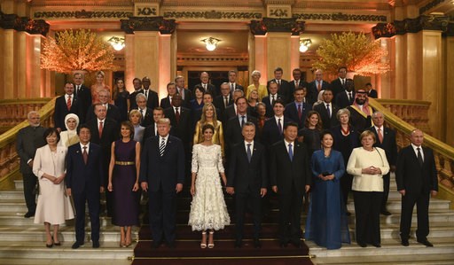 (G20 Press Office via AP). In this photo released by the press office of the G20 Summit, leaders and their partners pose for a group photo prior to a gala dinner at the Colon Theater in Buenos Aires, Argentina, Friday, Nov. 30, 2018. Leaders from the G... (G20 Press Office via AP). In this photo released by the press office of the G20 Summit, leaders and their partners pose for a group photo prior to a gala dinner at the Colon Theater in Buenos Aires, Argentina, Friday, Nov. 30, 2018. Leaders from the G...