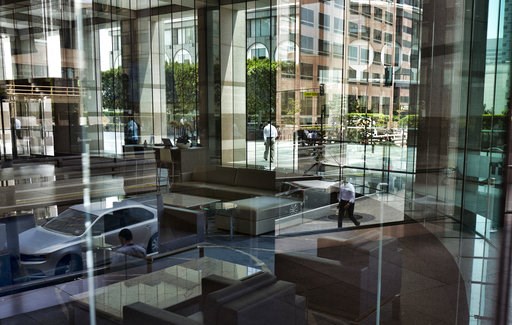 (AP Photo/Richard Vogel, File). FILE- In this Aug. 27, 2018, file photo buildings and officer workers are reflected on windows in downtown Los Angeles. General Motors’ plans to cut more than 8,000 white-collar workers are a warning that few jobs are sa... (AP Photo/Richard Vogel, File). FILE- In this Aug. 27, 2018, file photo buildings and officer workers are reflected on windows in downtown Los Angeles. General Motors’ plans to cut more than 8,000 white-collar workers are a warning that few jobs are sa...