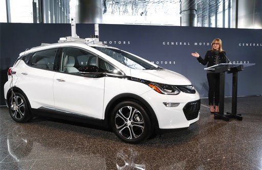 (AP Photo/Paul Sancya, File). FILE - In this Dec. 15, 2016, file photo, General Motors Chairman and CEO Mary Barra speaks next to a autonomous Chevrolet Bolt electric car in Detroit. The jobs that GM will shed through buyouts and layoffs are now held b... (AP Photo/Paul Sancya, File). FILE - In this Dec. 15, 2016, file photo, General Motors Chairman and CEO Mary Barra speaks next to a autonomous Chevrolet Bolt electric car in Detroit. The jobs that GM will shed through buyouts and layoffs are now held b...