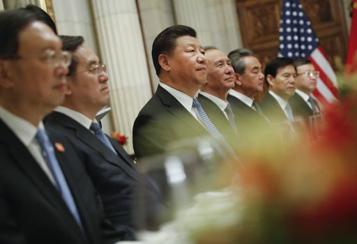 (AP Photo/Pablo Martinez Monsivais). China's President Xi Jinping, center, and members of his official delegation, listen to President Donald Trump speak during their bilateral meeting at the G20 Summit, Saturday, Dec. 1, 2018 in Buenos Aires, Argentina. (AP Photo/Pablo Martinez Monsivais). China's President Xi Jinping, center, and members of his official delegation, listen to President Donald Trump speak during their bilateral meeting at the G20 Summit, Saturday, Dec. 1, 2018 in Buenos Aires, Argentina.