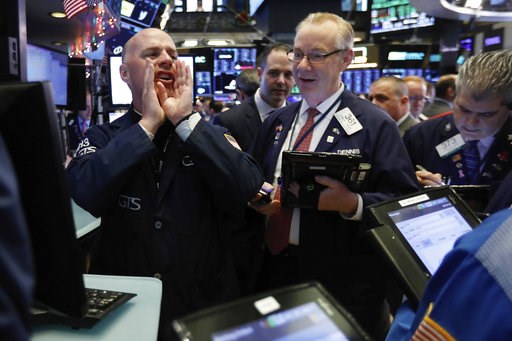 (AP Photo/Richard Drew). In this Thursday, Nov. 29, 2018, photo, specialist John O'Hara, left, works with traders at his post on the floor of the New York Stock Exchange. The new cease-fire in the trade dispute between the U.S. and China should boost r... (AP Photo/Richard Drew). In this Thursday, Nov. 29, 2018, photo, specialist John O'Hara, left, works with traders at his post on the floor of the New York Stock Exchange. The new cease-fire in the trade dispute between the U.S. and China should boost r...