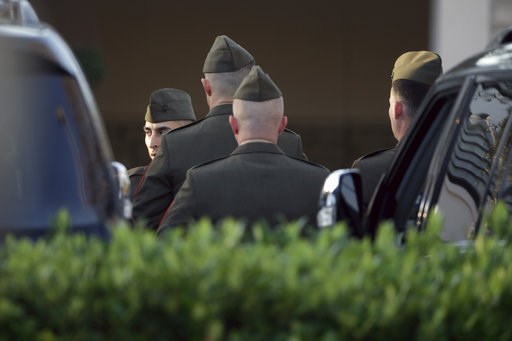 (AP Photo/Kiichiro Sato). Members of a color guard gather outside the George H. Lewis Funeral Home as they prepare for a departure ceremony for the state funeral for former President George H.W. Bush, Monday, Dec. 3, 2018, in Houston. (AP Photo/Kiichiro Sato). Members of a color guard gather outside the George H. Lewis Funeral Home as they prepare for a departure ceremony for the state funeral for former President George H.W. Bush, Monday, Dec. 3, 2018, in Houston.