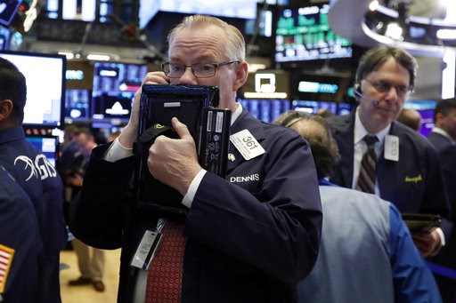 (AP Photo/Richard Drew, File). FILE- In this Thursday, Nov. 29, 2018, file photo trader Dennis Maguire, left, works on the floor of the New York Stock Exchange. The U.S. stock market opens at 9:30 a.m. EST on Monday, Dec. 3. (AP Photo/Richard Drew, File). FILE- In this Thursday, Nov. 29, 2018, file photo trader Dennis Maguire, left, works on the floor of the New York Stock Exchange. The U.S. stock market opens at 9:30 a.m. EST on Monday, Dec. 3.