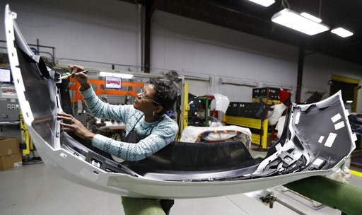 (AP Photo/Tony Dejak, File). FILE- In this Nov. 28, 2018, file photo final inspector Mary Skinner inspects the rear end of a General Motors Chevrolet Cruze at Jamestown Industries in Youngstown, Ohio. On Monday, Dec. 3, the Institute for Supply Managem... (AP Photo/Tony Dejak, File). FILE- In this Nov. 28, 2018, file photo final inspector Mary Skinner inspects the rear end of a General Motors Chevrolet Cruze at Jamestown Industries in Youngstown, Ohio. On Monday, Dec. 3, the Institute for Supply Managem...