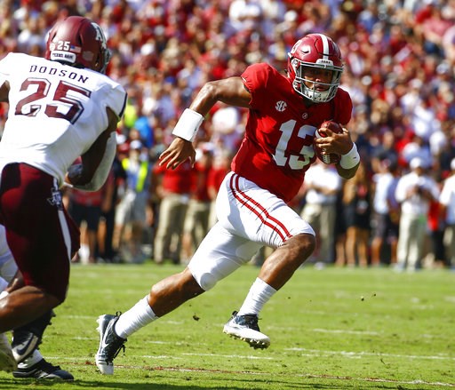 (AP Photo/Butch Dill, File). FILE - In this Sept. 22, 2018, file photo, Alabama quarterback Tua Tagovailoa (13) scrambles for a first down against Texas A&M during the first half of an NCAA college football game, in Tuscaloosa, Ala. Tagovailoa is ... (AP Photo/Butch Dill, File). FILE - In this Sept. 22, 2018, file photo, Alabama quarterback Tua Tagovailoa (13) scrambles for a first down against Texas A&M during the first half of an NCAA college football game, in Tuscaloosa, Ala. Tagovailoa is ...
