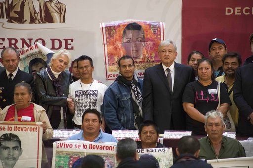 (AP Photo/Christian Palma). Mexico's President Andres Manuel Lopez Obrador poses for a photo with the parents of the 43 missing Mexican students of Ayotzinapa, at the National Palace in Mexico City, Monday, Dec. 3, 2018. Mexico's newly inaugurated pres... (AP Photo/Christian Palma). Mexico's President Andres Manuel Lopez Obrador poses for a photo with the parents of the 43 missing Mexican students of Ayotzinapa, at the National Palace in Mexico City, Monday, Dec. 3, 2018. Mexico's newly inaugurated pres...