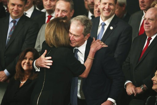 (Jonathan Ernst/Pool Photo via AP). Former President George W. Bush is embraced by Democratic House Leader Nancy Pelosi, D-Calif., during the arrival of the casket of former President George H.W. Bush into the Capitol in Washington, Monday, Dec. 3, 2018. (Jonathan Ernst/Pool Photo via AP). Former President George W. Bush is embraced by Democratic House Leader Nancy Pelosi, D-Calif., during the arrival of the casket of former President George H.W. Bush into the Capitol in Washington, Monday, Dec. 3, 2018.
