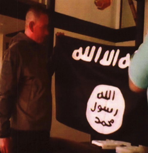 (FBI/U.S Attorney's Office, District of Hawaii via AP, File). FILE - In this undated file image taken from FBI video and provided by the U.S. Attorney's Office in Hawaii on Thursday, July 13, 2017, Army Sgt. 1st Class Ikaika Kang holds an Islamic State... (FBI/U.S Attorney's Office, District of Hawaii via AP, File). FILE - In this undated file image taken from FBI video and provided by the U.S. Attorney's Office in Hawaii on Thursday, July 13, 2017, Army Sgt. 1st Class Ikaika Kang holds an Islamic State...