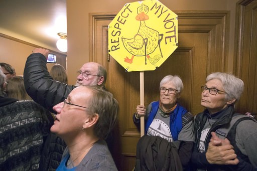 (Mark Hoffman/Milwaukee Journal-Sentinel via AP). People crowding a hallway vent their anger outside a lame duck session of the Joint Finance Committee Monday, December 3, 2018 at the Capitol in Madison, Wis. Wisconsin Republicans planned to forge ahea... (Mark Hoffman/Milwaukee Journal-Sentinel via AP). People crowding a hallway vent their anger outside a lame duck session of the Joint Finance Committee Monday, December 3, 2018 at the Capitol in Madison, Wis. Wisconsin Republicans planned to forge ahea...