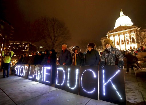 (John Hart/Wisconsin State Journal via AP). Opponents of an extraordinary session bill submitted by Wisconsin Republican legislators hold "Stop Lame Duck" signs at a rally outside the Wisconsin state Capitol in Madison, Wis., Monday, Dec. 3, 2018. (John Hart/Wisconsin State Journal via AP). Opponents of an extraordinary session bill submitted by Wisconsin Republican legislators hold "Stop Lame Duck" signs at a rally outside the Wisconsin state Capitol in Madison, Wis., Monday, Dec. 3, 2018.