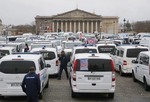 (AP Photo/Michel Euler). Ambulance workers block the bridge leading the National Assembly, background, in Paris, Monday, Dec. 3, 2018. Ambulance workers took to the streets and gathered close to the National Assembly in downtown Paris to complain about... (AP Photo/Michel Euler). Ambulance workers block the bridge leading the National Assembly, background, in Paris, Monday, Dec. 3, 2018. Ambulance workers took to the streets and gathered close to the National Assembly in downtown Paris to complain about...