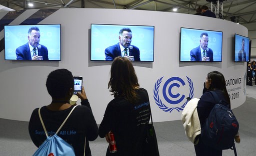 (AP Photo/Czarek Sokolowski). Visitors to the U.N. climate conference watch a speech by Arnold Schwarzenegger, in Katowice, Poland, Monday, Dec. 3, 2018. The COP24 UN Climate Change Conference is taking place in Katowice, Poland. Negotiators from aroun... (AP Photo/Czarek Sokolowski). Visitors to the U.N. climate conference watch a speech by Arnold Schwarzenegger, in Katowice, Poland, Monday, Dec. 3, 2018. The COP24 UN Climate Change Conference is taking place in Katowice, Poland. Negotiators from aroun...