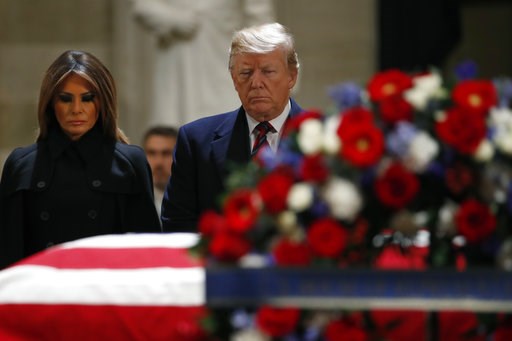 (AP Photo/Jacquelyn Martin). President Donald Trump and first lady Melania Trump pay their respects to former President George H. W. Bush, as he lies in state in the Rotunda of the U.S. Capitol, Monday, Dec. 3, 2018, in Washington. (AP Photo/Jacquelyn Martin). President Donald Trump and first lady Melania Trump pay their respects to former President George H. W. Bush, as he lies in state in the Rotunda of the U.S. Capitol, Monday, Dec. 3, 2018, in Washington.