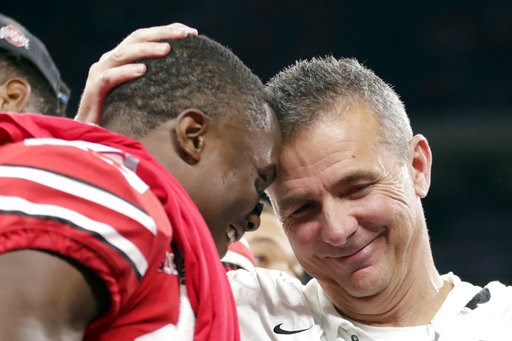 (AP Photo/Michael Conroy). Ohio State head coach Urban Meyer and wide receiver Terry McLaurin, left, celebrate early Sunday, Dec. 2, 2018, after defeating Northwestern 45-24 in the Big Ten championship NCAA college football game in Indianapolis. (AP Photo/Michael Conroy). Ohio State head coach Urban Meyer and wide receiver Terry McLaurin, left, celebrate early Sunday, Dec. 2, 2018, after defeating Northwestern 45-24 in the Big Ten championship NCAA college football game in Indianapolis.