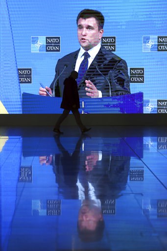 (AP Photo/Francisco Seco). A man walks by a large screen projecting the media conference of Ukraine's Foreign Minister Pavlo Klimkin after a meeting of NATO foreign ministers at NATO headquarters in Brussels, Tuesday, Dec. 4, 2018. Russia takes center-... (AP Photo/Francisco Seco). A man walks by a large screen projecting the media conference of Ukraine's Foreign Minister Pavlo Klimkin after a meeting of NATO foreign ministers at NATO headquarters in Brussels, Tuesday, Dec. 4, 2018. Russia takes center-...