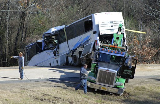 (Josh Briggs/Saline Courier via AP). Employees from a wrecker service work to remove a charter bus from a roadside ditch Monday, Dec. 3, 2018, after it crashed alongside Interstate 30 near Benton, Ark. The bus was carrying a youth football team from Te... (Josh Briggs/Saline Courier via AP). Employees from a wrecker service work to remove a charter bus from a roadside ditch Monday, Dec. 3, 2018, after it crashed alongside Interstate 30 near Benton, Ark. The bus was carrying a youth football team from Te...