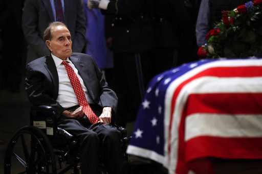 (AP Photo/Manuel Balce Ceneta). Former Sen. Bob Dole pays his last respects to former President George H.W. Bush as he lies in state at the U.S. Capitol in Washington, Tuesday, Dec. 4, 2018. (AP Photo/Manuel Balce Ceneta). Former Sen. Bob Dole pays his last respects to former President George H.W. Bush as he lies in state at the U.S. Capitol in Washington, Tuesday, Dec. 4, 2018.