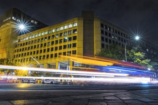 (AP Photo/J. David Ake). FILE - In this Nov. 1, 2017, file photo, traffic along Pennsylvania Avenue in Washington streaks past the Federal Bureau of Investigation headquarters building. The National Republican Congressional Committee said Tuesday that ...