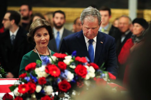 (AP Photo/Manuel Balce Ceneta). Former President George W. Bush and former first lady Laura Bush pay their respect to his father former President George H.W. Bush as he lie in state at the U.S. Capitol in Washington, Tuesday, Dec. 4, 2018. (AP Photo/Manuel Balce Ceneta). Former President George W. Bush and former first lady Laura Bush pay their respect to his father former President George H.W. Bush as he lie in state at the U.S. Capitol in Washington, Tuesday, Dec. 4, 2018.