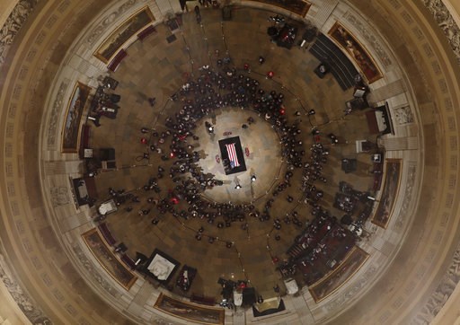 (AP Photo/Morry Gash, Pool). Members of the Bush family gather near the casket of Former President George H. W. Bush as he lies in state in the U.S. Capitol Rotunda Tuesday, Dec. 4, 2018, in Washington. (AP Photo/Morry Gash, Pool). Members of the Bush family gather near the casket of Former President George H. W. Bush as he lies in state in the U.S. Capitol Rotunda Tuesday, Dec. 4, 2018, in Washington.
