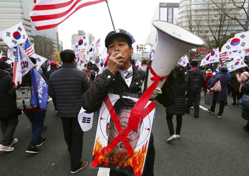 (AP Photo/Ahn Young-joon, File). FILE - In this Nov. 17, 2018, file photo, a protester with a defaced portrait of North Korean leader Kim Jong Un shouts during a rally to denounce policies of South Korean President Moon Jae-in on North Korea in Seoul, ... (AP Photo/Ahn Young-joon, File). FILE - In this Nov. 17, 2018, file photo, a protester with a defaced portrait of North Korean leader Kim Jong Un shouts during a rally to denounce policies of South Korean President Moon Jae-in on North Korea in Seoul, ...