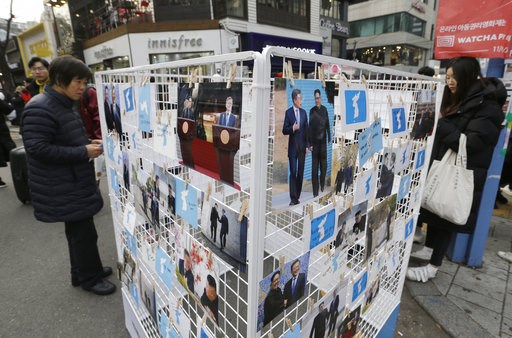 (AP Photo/Ahn Young-joon, File). FILE - In this Nov. 25, 2018, file photo, photos of South Korean President Moon Jae-in and North Korean leader Kim Jong Un and unification flags are displayed during a campaign to welcome Kim's possible visit to the Sou... (AP Photo/Ahn Young-joon, File). FILE - In this Nov. 25, 2018, file photo, photos of South Korean President Moon Jae-in and North Korean leader Kim Jong Un and unification flags are displayed during a campaign to welcome Kim's possible visit to the Sou...