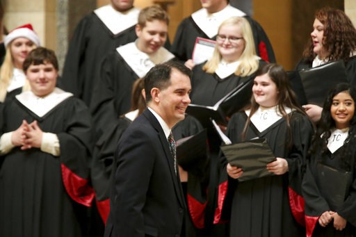(Steve Apps/Wisconsin State Journal via AP). Wisconsin Gov. Scott Walker arrives for the lighting of the state Christmas Tree in the Capitol Rotunda, Tuesday, Dec. 4, 2018 at the Capitol in Madison, Wis. The Senate and Assembly are set to send dozens o... (Steve Apps/Wisconsin State Journal via AP). Wisconsin Gov. Scott Walker arrives for the lighting of the state Christmas Tree in the Capitol Rotunda, Tuesday, Dec. 4, 2018 at the Capitol in Madison, Wis. The Senate and Assembly are set to send dozens o...