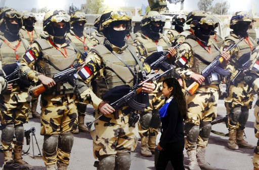 (AP Photo/Amr Nabil). A visitor walks past a banner displaying Egyptian commandos during the first arms fair organized in Cairo, Egypt, Monday, Dec. 3, 2018. Egypt's President Abdel-Fattah el-Sissi inaugurated the fair, where hundreds of companies are ... (AP Photo/Amr Nabil). A visitor walks past a banner displaying Egyptian commandos during the first arms fair organized in Cairo, Egypt, Monday, Dec. 3, 2018. Egypt's President Abdel-Fattah el-Sissi inaugurated the fair, where hundreds of companies are ...