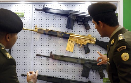 (AP Photo/Amr Nabil). Egyptian army officers look at a gold-plated weapon at the Pakistani booth during the first arms fair organized in Cairo, Egypt, Tuesday, Dec. 4, 2018. The three-day Egypt Defence Expo features the world’s top arms companies and h... (AP Photo/Amr Nabil). Egyptian army officers look at a gold-plated weapon at the Pakistani booth during the first arms fair organized in Cairo, Egypt, Tuesday, Dec. 4, 2018. The three-day Egypt Defence Expo features the world’s top arms companies and h...