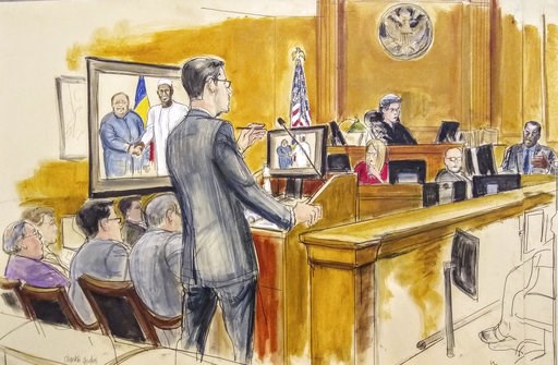(Elizabeth Williams via AP). In this courtroom drawing, Assistant U.S. Attorney Douglas Zolkind, standing, addresses cooperating witness Cheikh Gadio, far right, during Hong Kong businessman Dr. Chi Ping Patrick Ho's bribery trial in New York, Wednesda... (Elizabeth Williams via AP). In this courtroom drawing, Assistant U.S. Attorney Douglas Zolkind, standing, addresses cooperating witness Cheikh Gadio, far right, during Hong Kong businessman Dr. Chi Ping Patrick Ho's bribery trial in New York, Wednesda...
