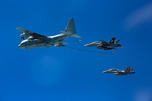 (Cpl. Trever Statz/U.S. Marine Corps via AP). In this Oct. 13, 2016, photo provided by U.S. Marine Corps, two F/A-18D Hornets with Marine All-Weather Fighter Attack Squadron 533 approach a KC-130J with Marine Aerial Refueler Transport Squadron 352 duri... (Cpl. Trever Statz/U.S. Marine Corps via AP). In this Oct. 13, 2016, photo provided by U.S. Marine Corps, two F/A-18D Hornets with Marine All-Weather Fighter Attack Squadron 533 approach a KC-130J with Marine Aerial Refueler Transport Squadron 352 duri...