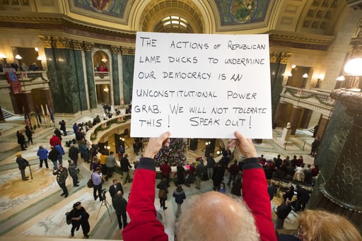(Mark Hoffman/Milwaukee Journal-Sentinel via AP). People protest the legislature's extraordinary session during the official Christmas tree lighting ceremony at the Capitol in Madison, Wis., Tuesday, Dec. 4, 2018. Demonstrators booed outgoing Wisconsin... (Mark Hoffman/Milwaukee Journal-Sentinel via AP). People protest the legislature's extraordinary session during the official Christmas tree lighting ceremony at the Capitol in Madison, Wis., Tuesday, Dec. 4, 2018. Demonstrators booed outgoing Wisconsin...