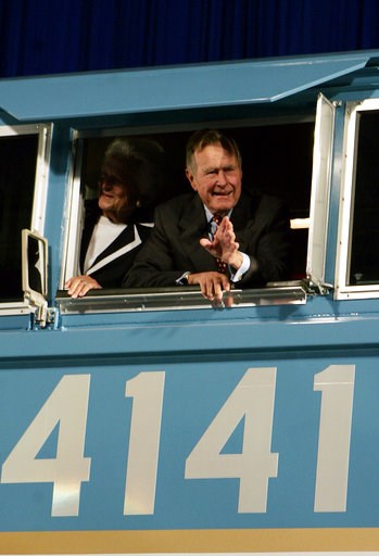 (AP Photo/Pat Sullivan, File). FILE - In this Oct. 18, 2005, file photo, former President George H.W. Bush and his wife Barbara wave out the window of a new locomotive numbered 4141 in honor of the 41st president at Texas A&M University in College ... (AP Photo/Pat Sullivan, File). FILE - In this Oct. 18, 2005, file photo, former President George H.W. Bush and his wife Barbara wave out the window of a new locomotive numbered 4141 in honor of the 41st president at Texas A&M University in College ...