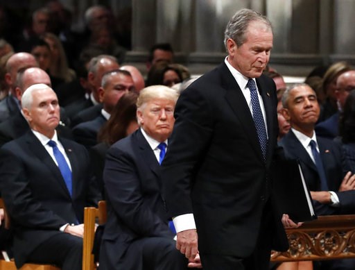 (AP Photo/Alex Brandon, Pool). Former President George W. Bush walks past President Donald Trump and former President Barack Obama to speak a State Funeral for President George H.W. Bush, at the National Cathedral, Wednesday, Dec. 5, 2018, in Washingto... (AP Photo/Alex Brandon, Pool). Former President George W. Bush walks past President Donald Trump and former President Barack Obama to speak a State Funeral for President George H.W. Bush, at the National Cathedral, Wednesday, Dec. 5, 2018, in Washingto...