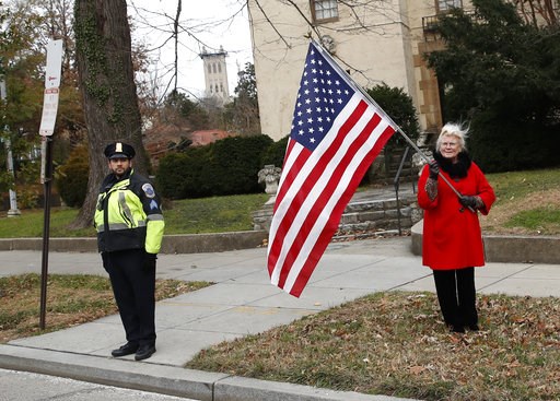 (AP Photo/Alex Brandon, Pool). People line the streets to pay their respects as the hearse with the casket of former President George H.W. Bush passes by from the Capitol on the way to a State Funeral at the National Cathedral, Wednesday, Dec. 5, 2018,... (AP Photo/Alex Brandon, Pool). People line the streets to pay their respects as the hearse with the casket of former President George H.W. Bush passes by from the Capitol on the way to a State Funeral at the National Cathedral, Wednesday, Dec. 5, 2018,...