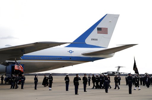 (AP Photo/Alex Brandon, Pool). The flag-draped casket of former President George H.W. Bush is carried by a joint services military honor guard to Special Air Mission 41, Wednesday, Dec. 5, 2018, at Andrews Air Force Base, Md. (AP Photo/Alex Brandon, Pool). The flag-draped casket of former President George H.W. Bush is carried by a joint services military honor guard to Special Air Mission 41, Wednesday, Dec. 5, 2018, at Andrews Air Force Base, Md.