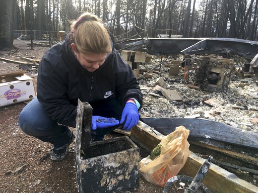 Residents head back into California town leveled by wildfire