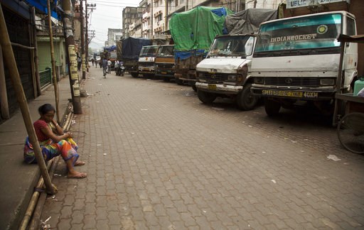 (AP Photo/Anupam Nath). FILE - In this Monday, Sept. 10, 2018 file photo, a laborer sits near trucks at a closed market during a day-long strike to protest rising fuel prices among other economy issues, in Gauhati, India. Even proponents of carbon taxe... (AP Photo/Anupam Nath). FILE - In this Monday, Sept. 10, 2018 file photo, a laborer sits near trucks at a closed market during a day-long strike to protest rising fuel prices among other economy issues, in Gauhati, India. Even proponents of carbon taxe...