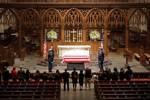 (AP Photo/Mark Humphrey). Visitors pay their respects to the flag-draped casket of former President George H.W. Bush at St. Martin's Episcopal Church, Wednesday, Dec. 5, 2018, in Houston. (AP Photo/Mark Humphrey). Visitors pay their respects to the flag-draped casket of former President George H.W. Bush at St. Martin's Episcopal Church, Wednesday, Dec. 5, 2018, in Houston.