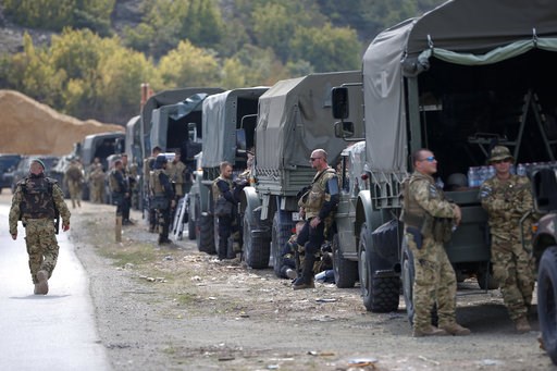 (AP Photo/Visar Kryeziu). In this photo taken on Sept. 9, 2018, soldiers of NATO-led peacekeeping force KFOR take a break by the side of the road in the village of Kosterc, Kosovo. Serbia's prime minister warned on Wednesday that the formation of a Kos... (AP Photo/Visar Kryeziu). In this photo taken on Sept. 9, 2018, soldiers of NATO-led peacekeeping force KFOR take a break by the side of the road in the village of Kosterc, Kosovo. Serbia's prime minister warned on Wednesday that the formation of a Kos...