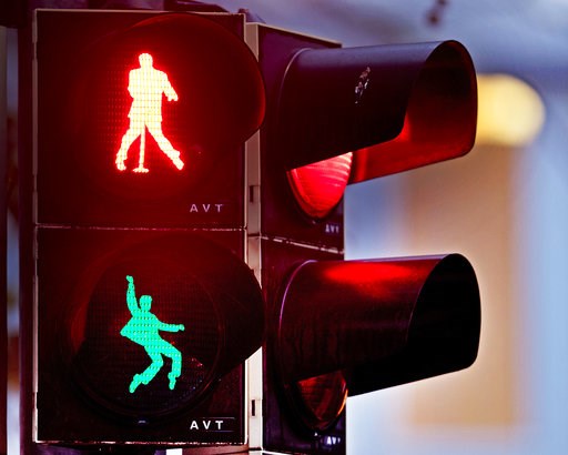 ( AP Photo/Michael Probst). Walking figures depicting late US rock and roll legend Elvis Presley appear on a traffic light switching from green to red in Friedberg near Frankfurt, Germany, Thursday, Dec. 6, 2018. Presley served in Friedberg from Octobe...
