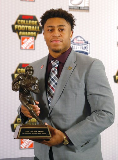 (AP Photo/John Bazemore). Wisconsin's Jonathan Taylor poses with the trophy after winning the Doak Walker Award as top running back in college football, Thursday, Dec. 6, 2018, in Atlanta. (AP Photo/John Bazemore). Wisconsin's Jonathan Taylor poses with the trophy after winning the Doak Walker Award as top running back in college football, Thursday, Dec. 6, 2018, in Atlanta.