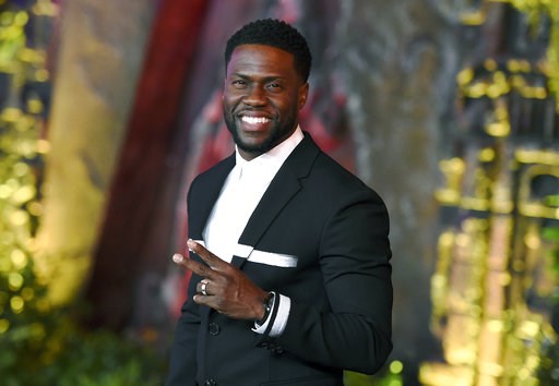(Photo by Jordan Strauss/Invision/AP, File). FILE - In this Dec. 11, 2017 file photo, Kevin Hart arrives at the Los Angeles premiere of "Jumanji: Welcome to the Jungle" in Los Angeles. Hart will host the 2019 Academy Awards, fulfilling a lifelong dream...